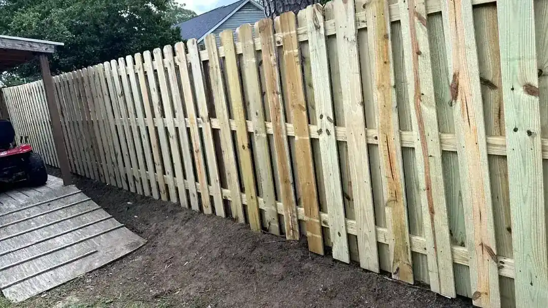 Wood fence on a Lowndes County, Georgia property among pines